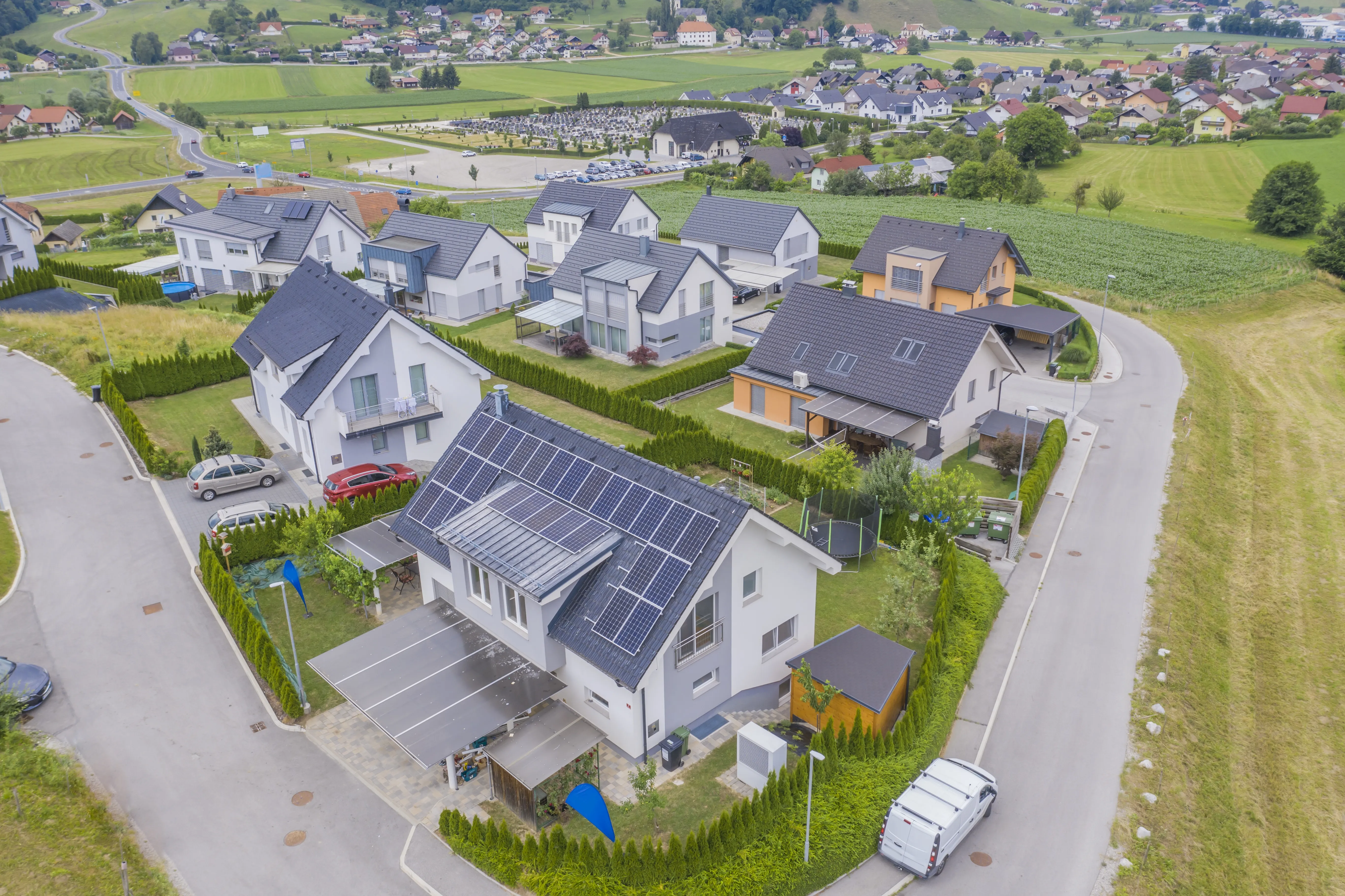 Aerial view of a residential development where houses have solar panels on their roofs